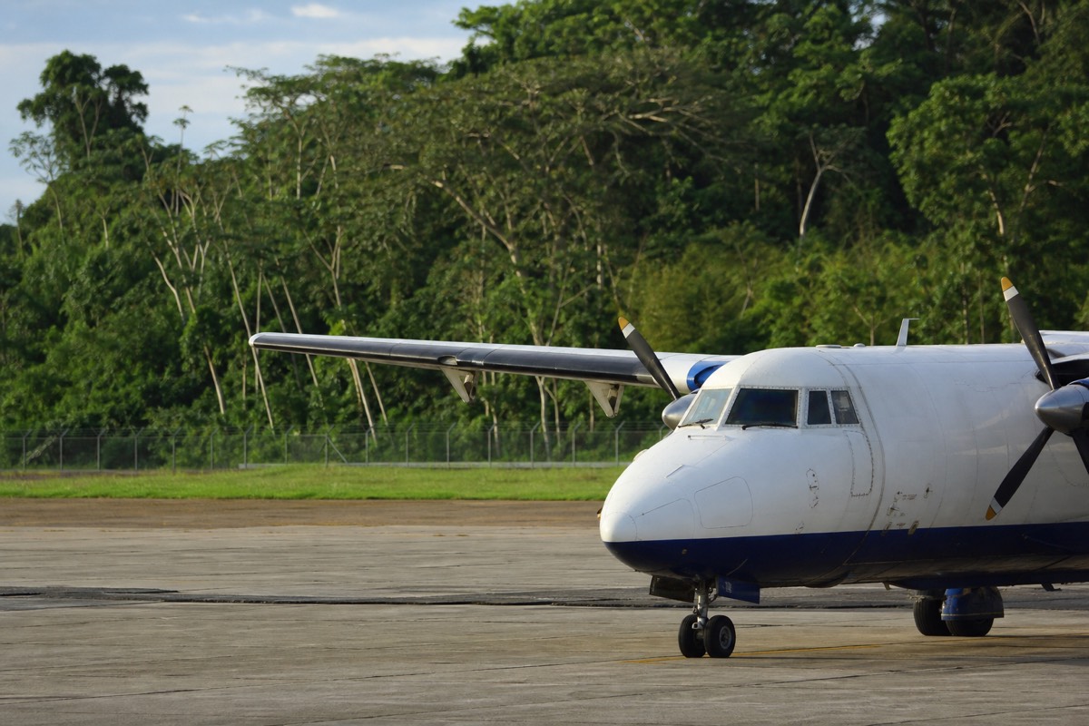 A small plane at the jungle-ringed Iquitos airport, the main entry point for Amazon tours from Iquitos